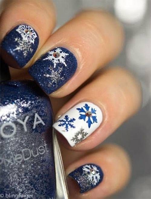 blue snowflake glitter nail design